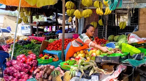 a saleswoman vending vegetables typically from a temporary store or sheet